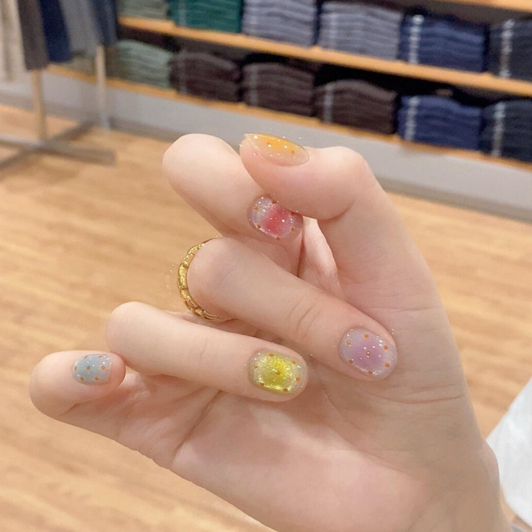Glittering artificial nail tips in cheerful design Bowlift