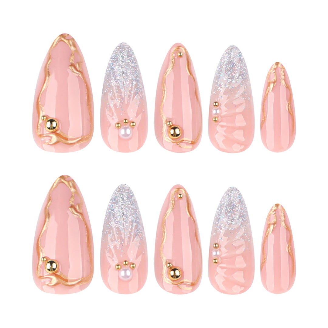Artful stiletto nails with elegant gold embellishment design Bowlift