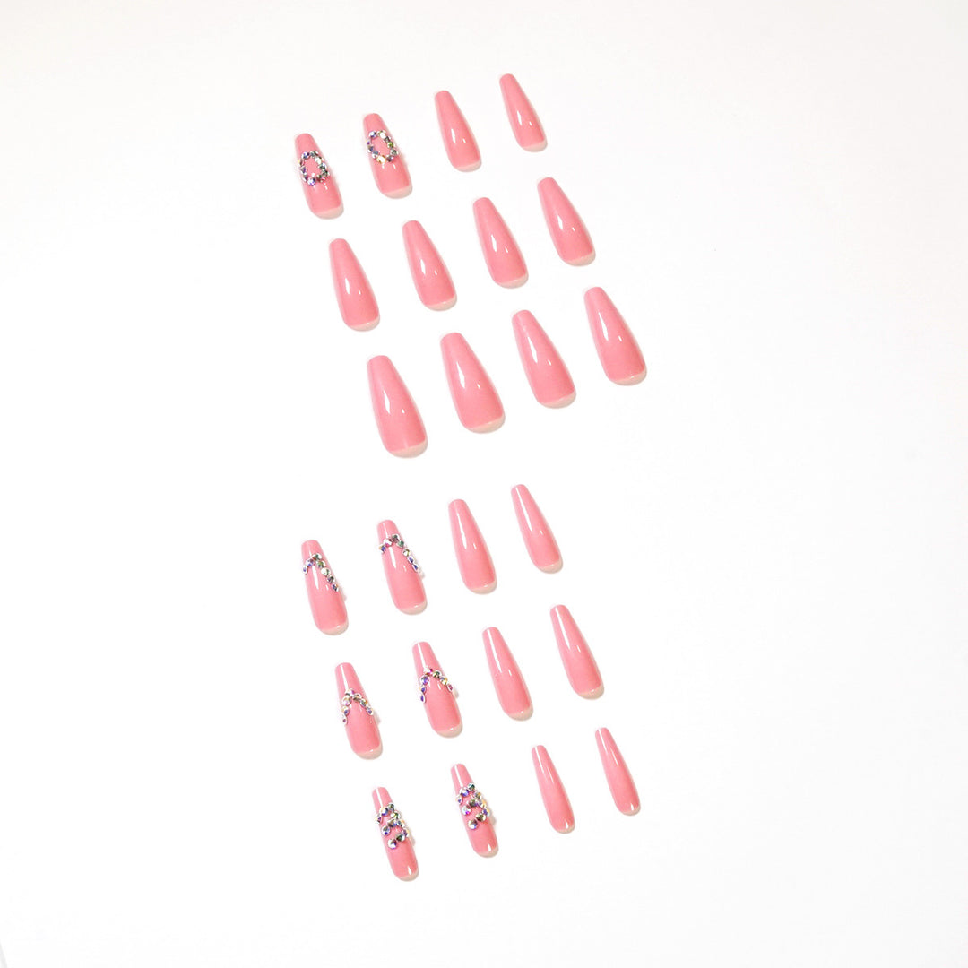 Artificial nail extensions with elegant rhinestone embellishments Bowlift