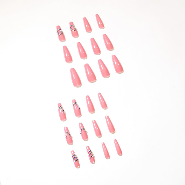Artificial nail extensions with elegant rhinestone embellishments Bowlift