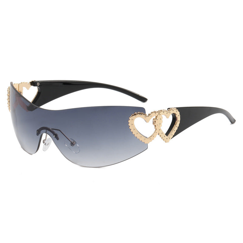 Ladies sporty sunglasses in trendy shield design with heart accents Bowlift