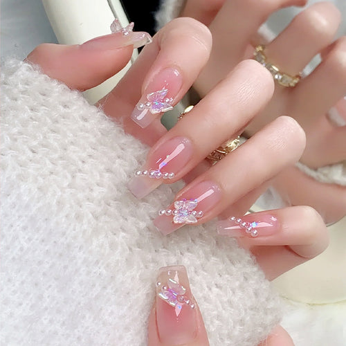 Artificial nails with luxurious pearl and glitter decorations Bowlift