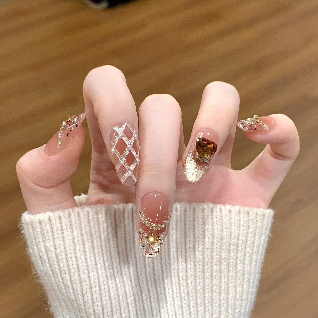 Glamorous artificial nails with glitter and heart design Bowlift
