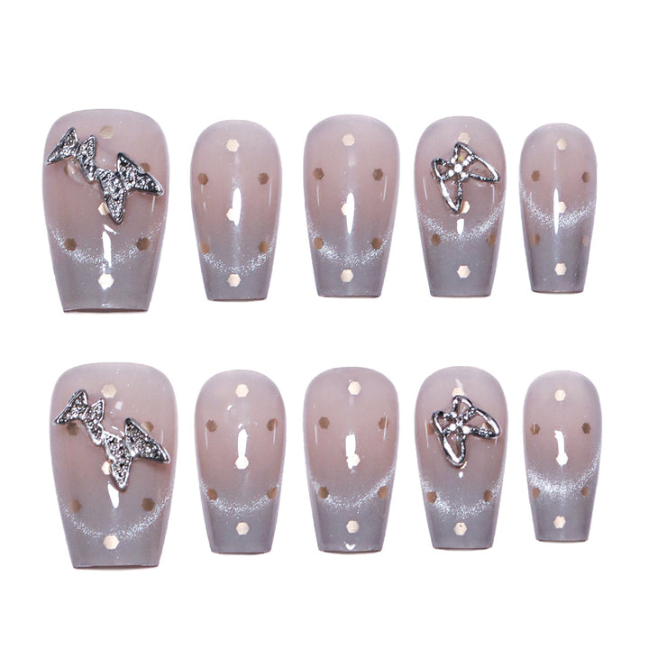 Artificial nail art with glitter details and bow accents Bowlift