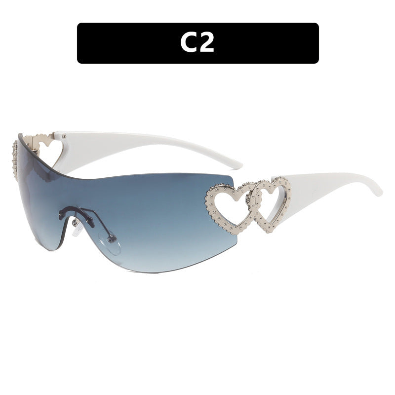 Ladies sporty sunglasses in trendy shield design with heart accents Bowlift