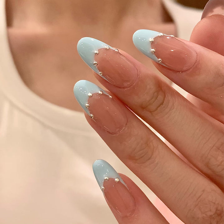Artistic French Tip Nail Design with Glitter Accents Bowlift
