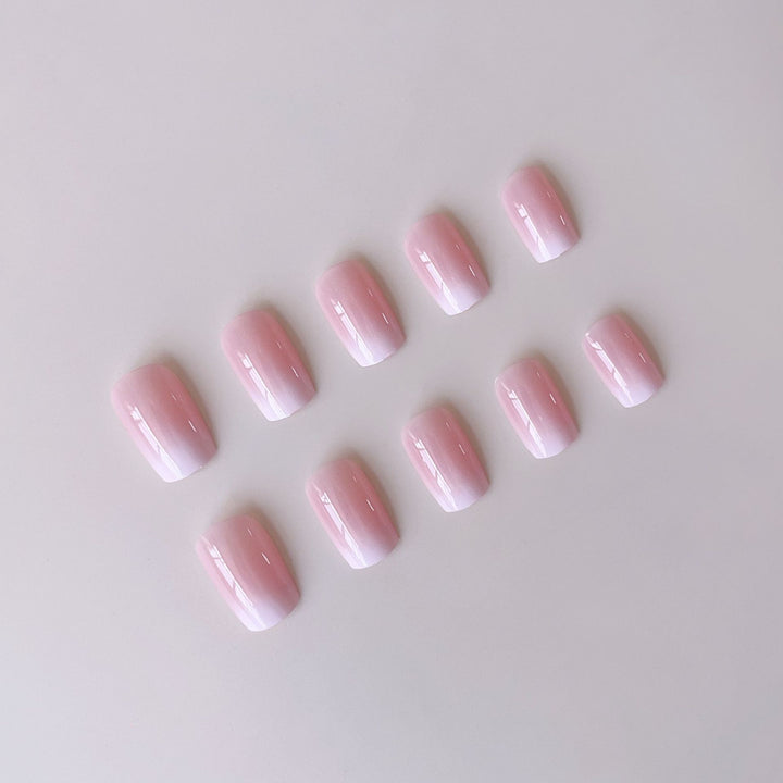 Acrylic nail set with elegant ombre design and glitter accents Bowlift