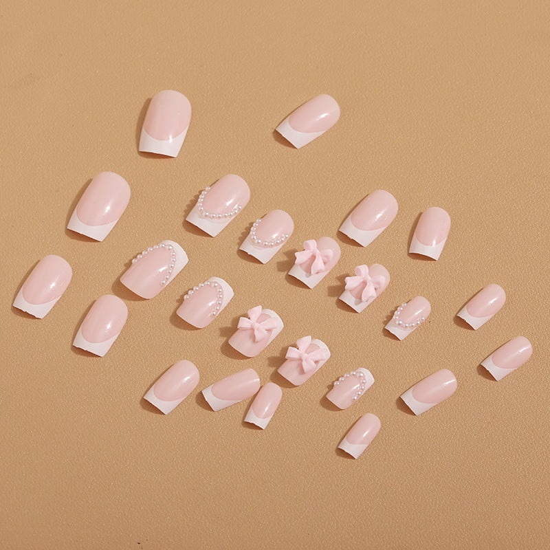 Artificial nail tips with elegant bows and pearl decorations Bowlift