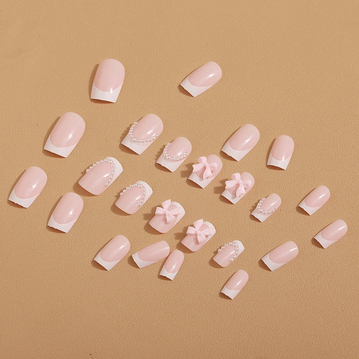 Artificial nail tips with elegant bows and pearl decorations Bowlift