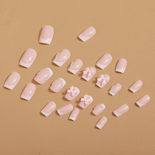 Artificial nail tips with elegant bows and pearl decorations Bowlift