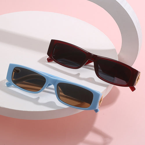 Ladies fashionable sunglasses with asymmetrical frame and gold-colored details Bowlift