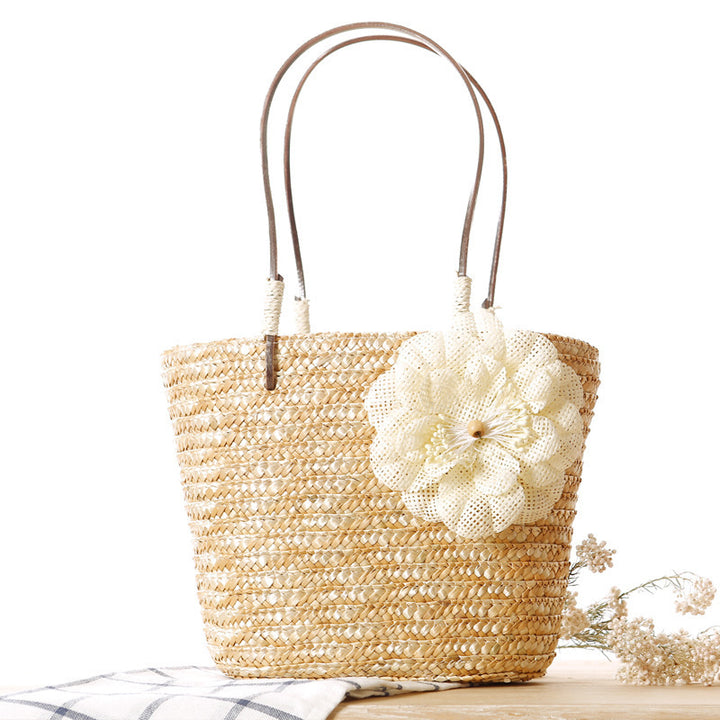 Beach bag with decorative flower detail embellishment Bowlift