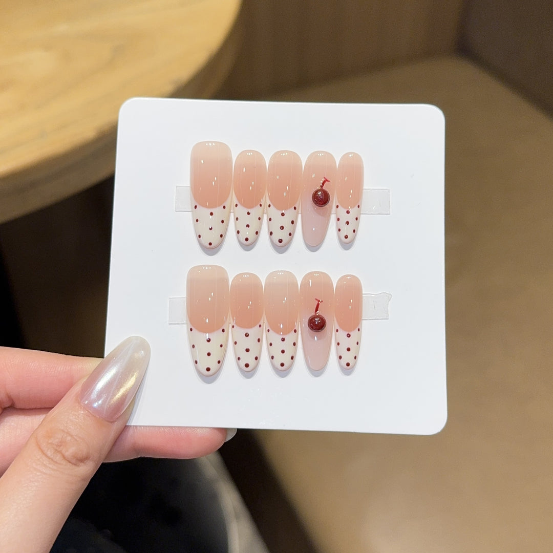 Artificial nails with playful design and cherry accents Bowlift