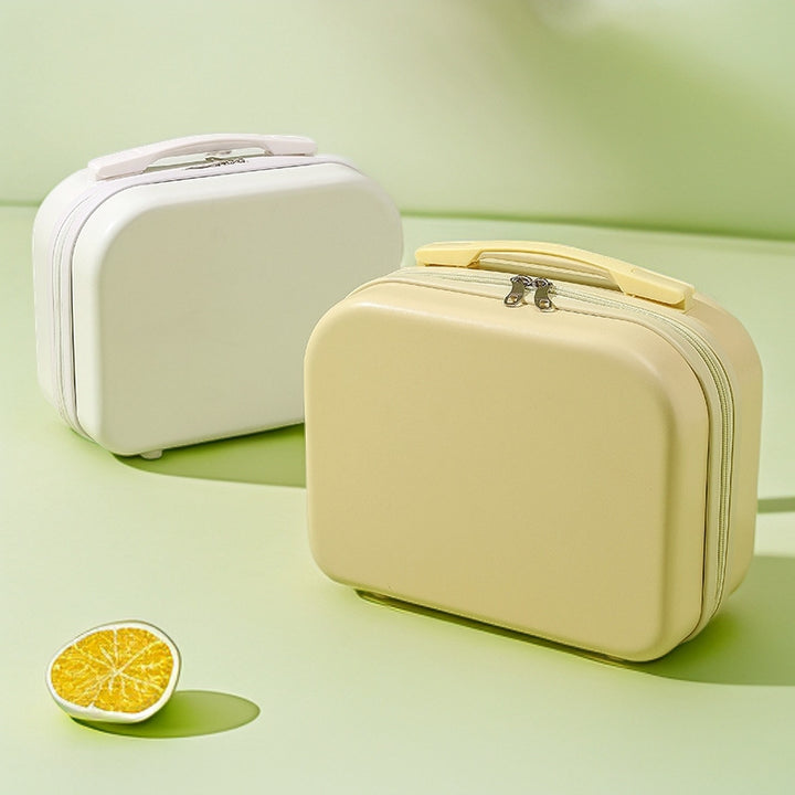 hard-shell travel vanity case with molded handle and double-zip closure Bowlift