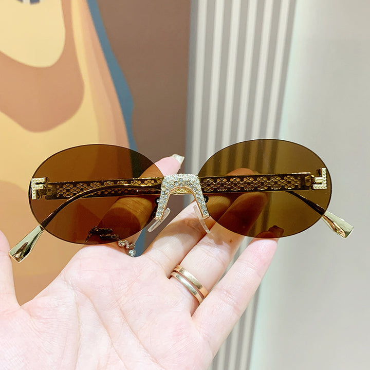 Women's sunglasses with glittering frame and oval lenses Bowlift