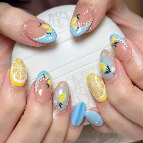 Artificial nail art with lemon and flower motifs Bowlift