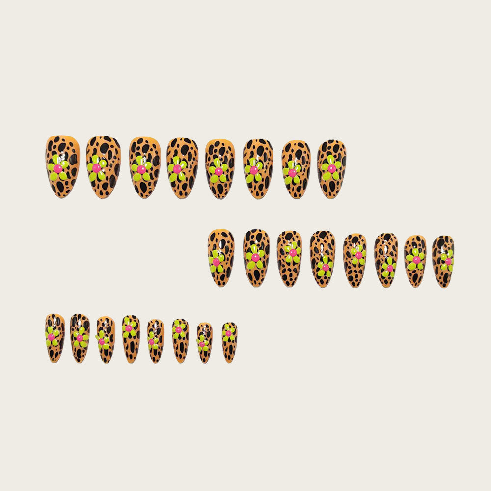 Glamorous nail art with leopard pattern and flower appliqués Bowlift