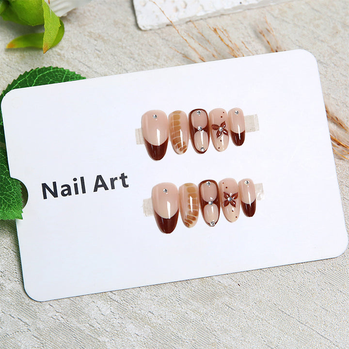 Artificial nails with elegant motif designs Bowlift