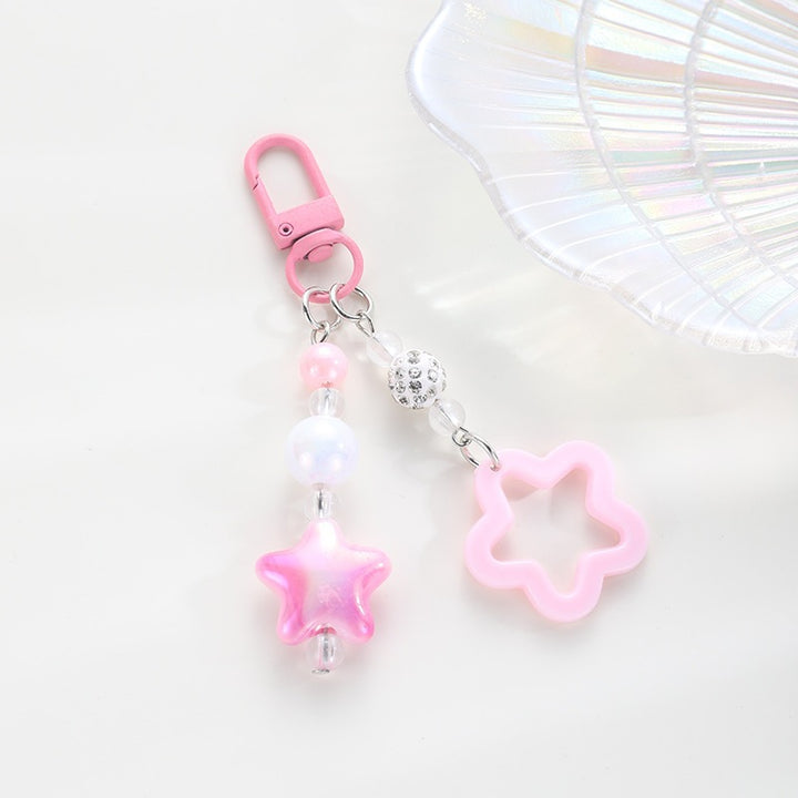 Playful keychain with floral and star motif Bowlift