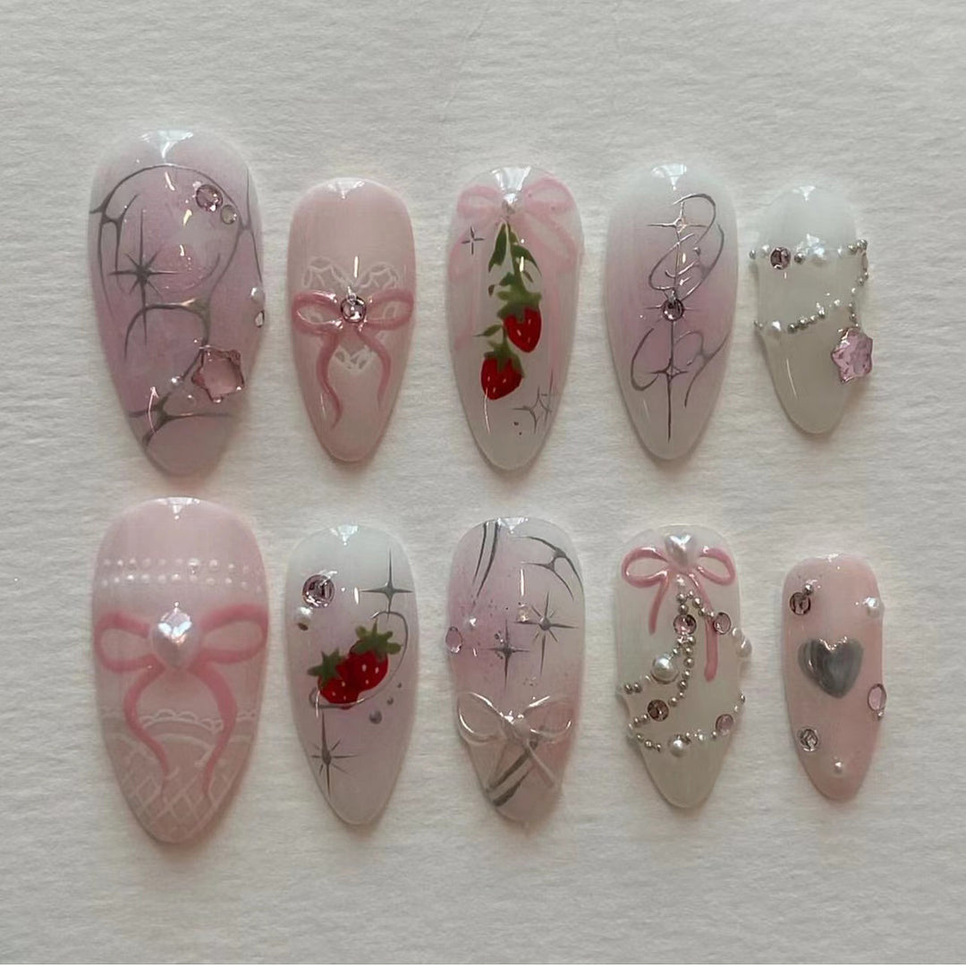 Artificial nail art with romantic design and glitter accents Bowlift