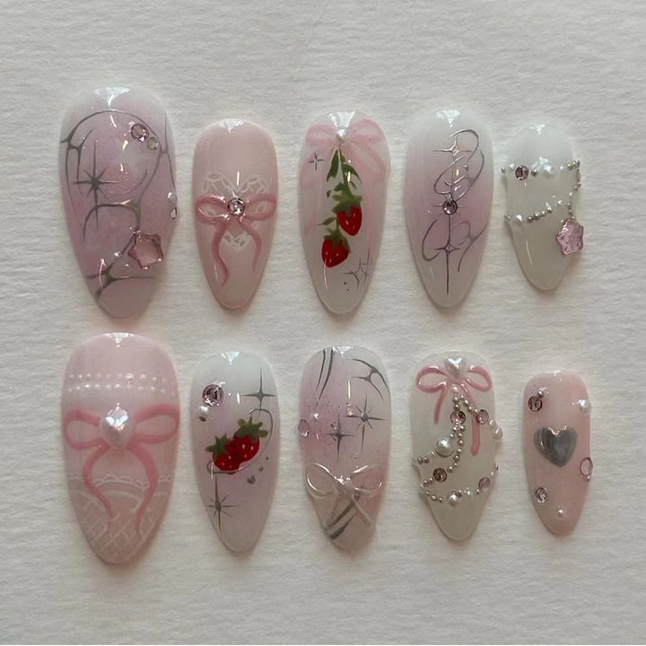 Artificial nail art with romantic design and glitter accents Bowlift
