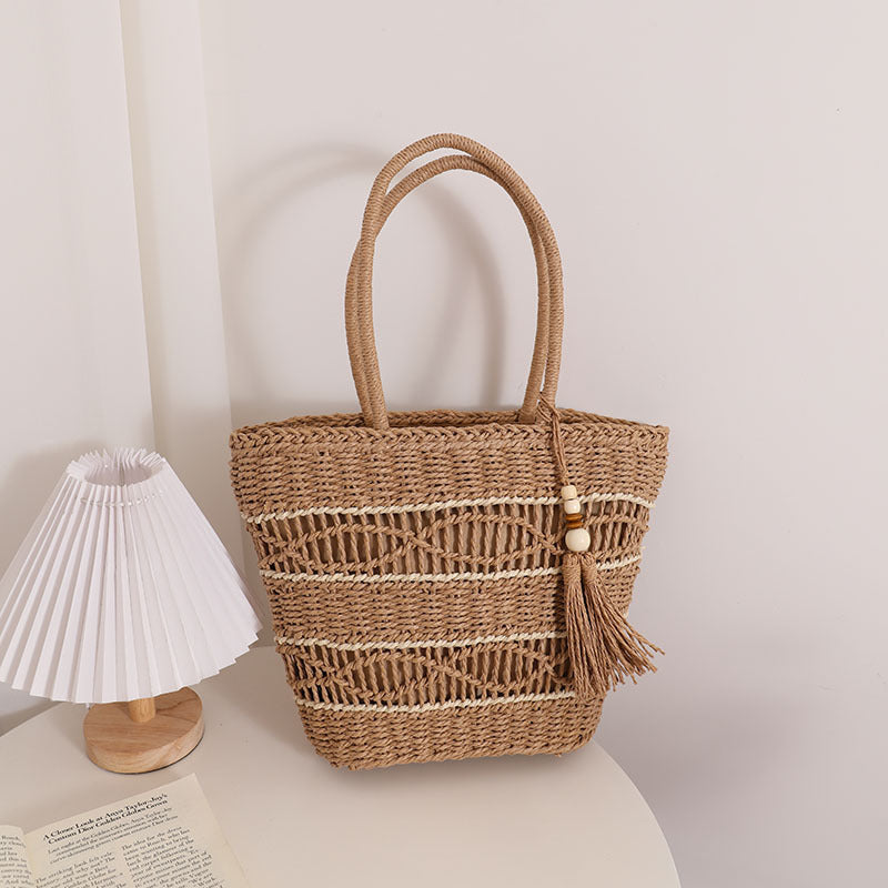 Handcrafted straw tote bag with decorative tassel detail Bowlift