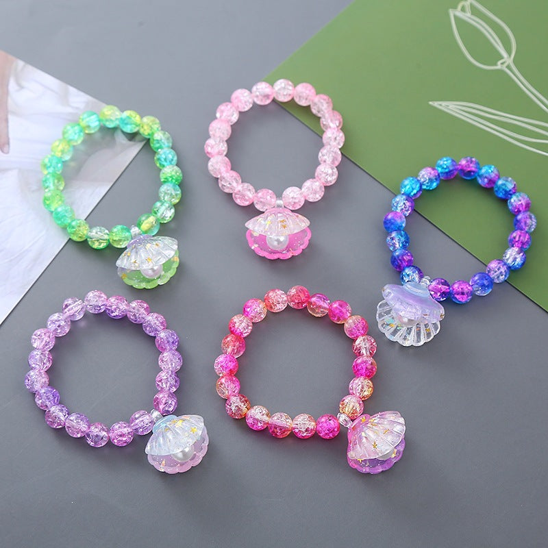 Playful bracelet with shell pendant Bowlift