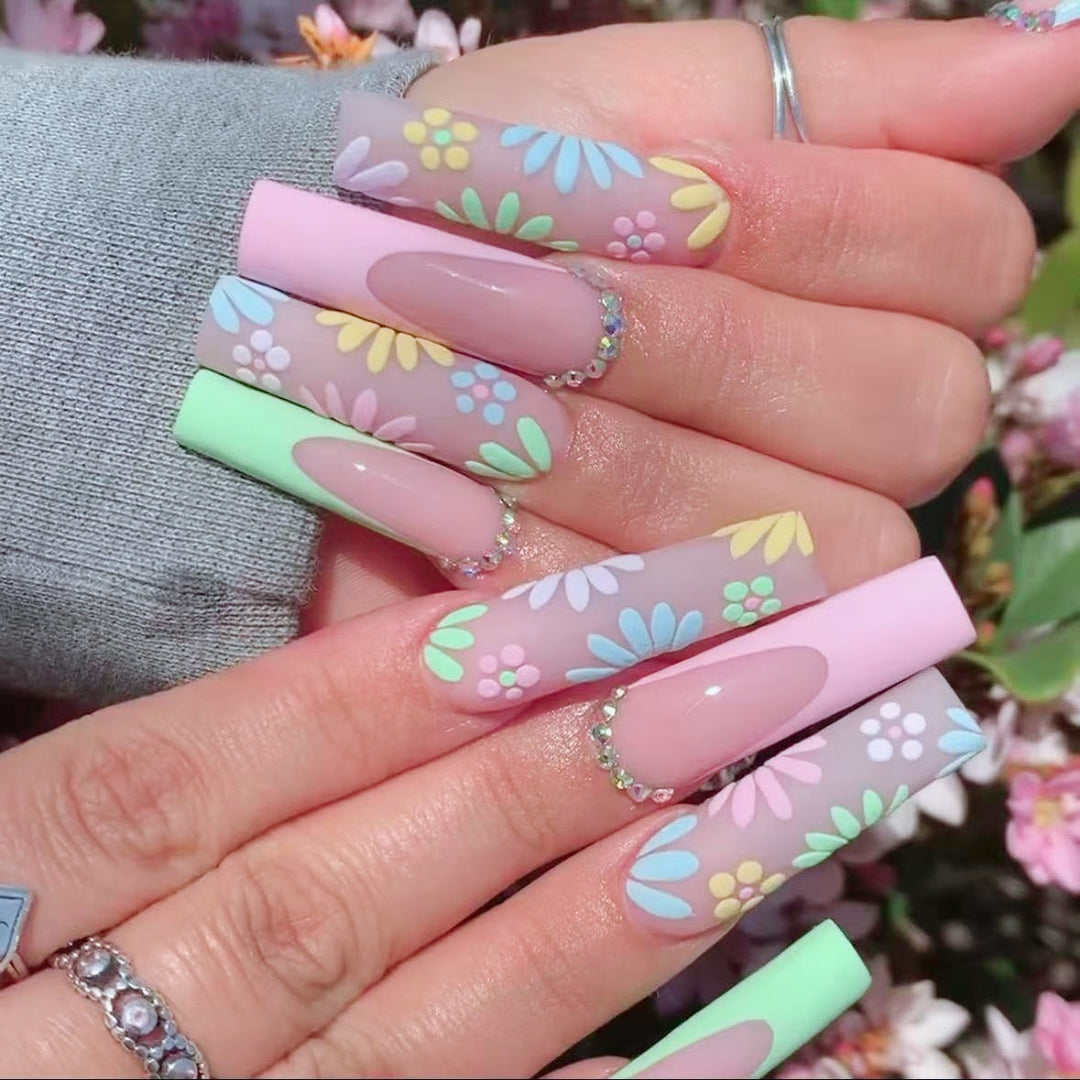 Artificial nail set with floral 3D embellishments and rhinestone accents Bowlift