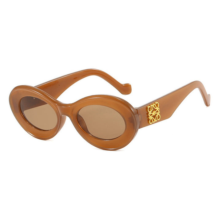 Women's fashionable sunglasses with oval frame and golden accents Bowlift