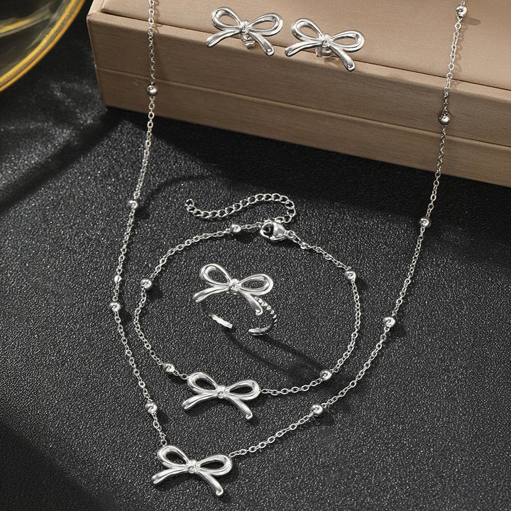 BowLift | Feminine Bow Satellite Chain Necklace, Bracelet, Earrings, and Ring Set