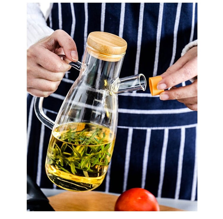 Transparent glass oil bottle with handle Bowlift