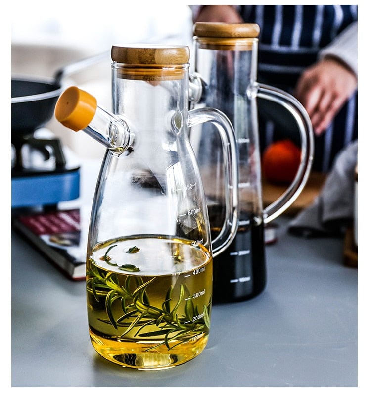 Transparent glass oil bottle with handle Bowlift