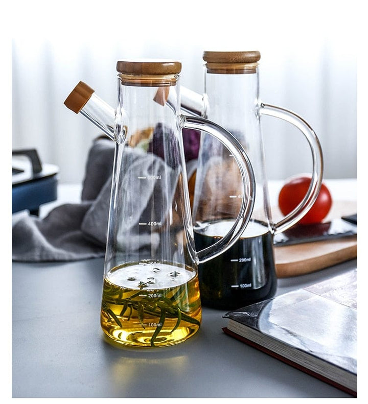 Transparent glass oil bottle with handle Bowlift