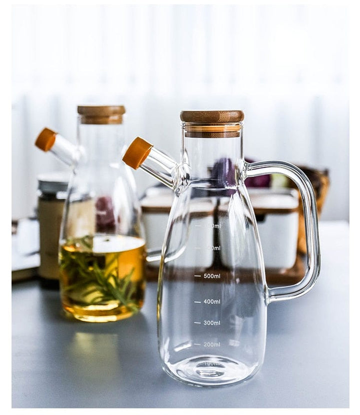 Transparent glass oil bottle with handle Bowlift