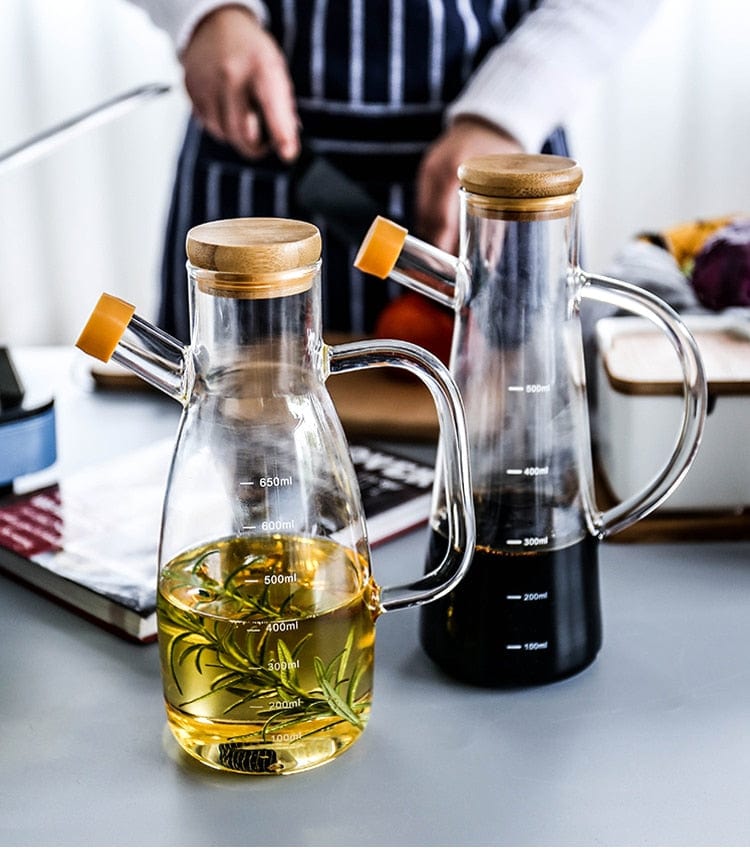 Transparent glass oil bottle with handle Bowlift