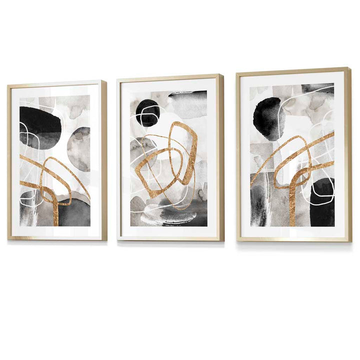 Abstract black, gray, and gold shapes set of 3 framed wall art prints | Bowlift