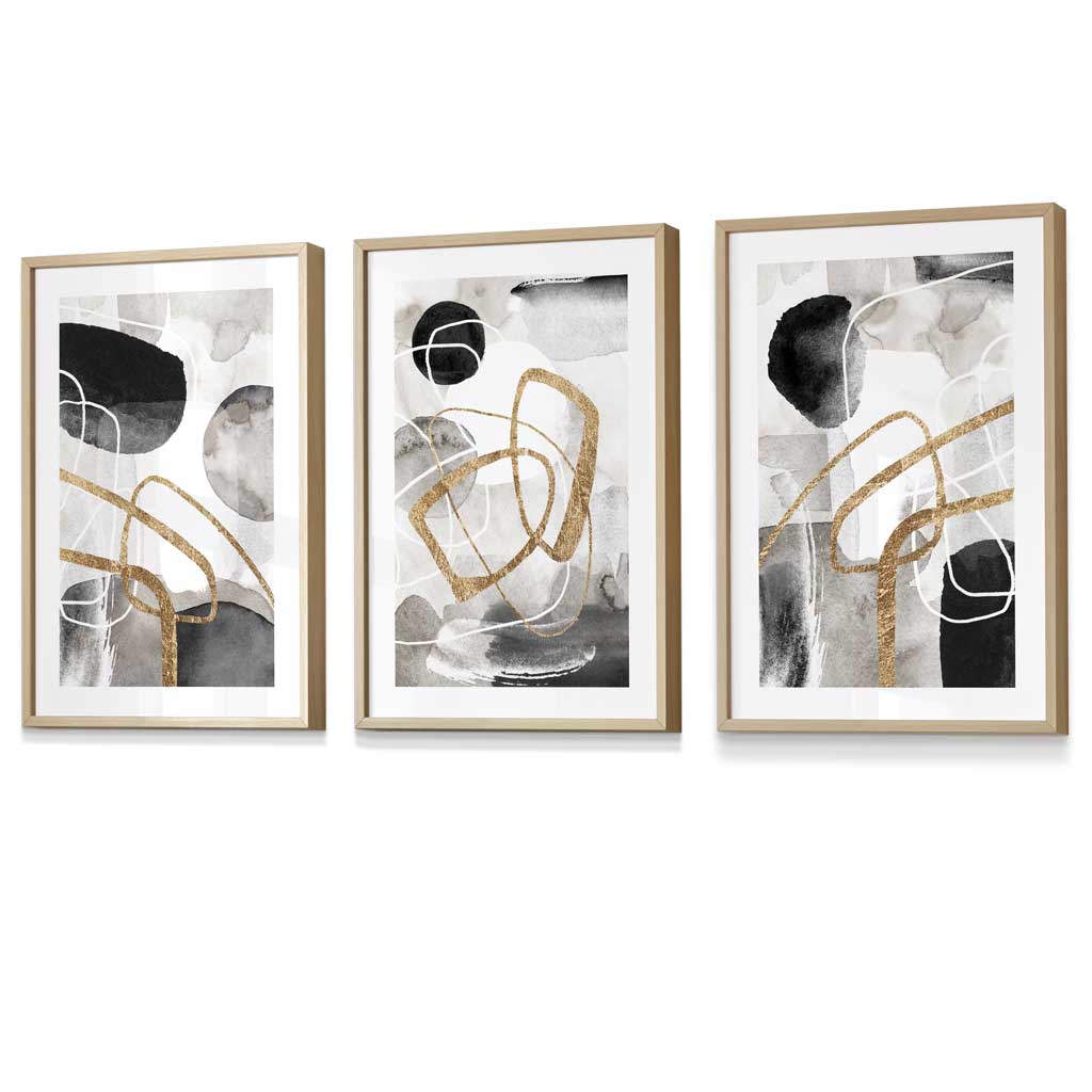 Abstract black, gray, and gold shapes set of 3 framed wall art prints | Bowlift