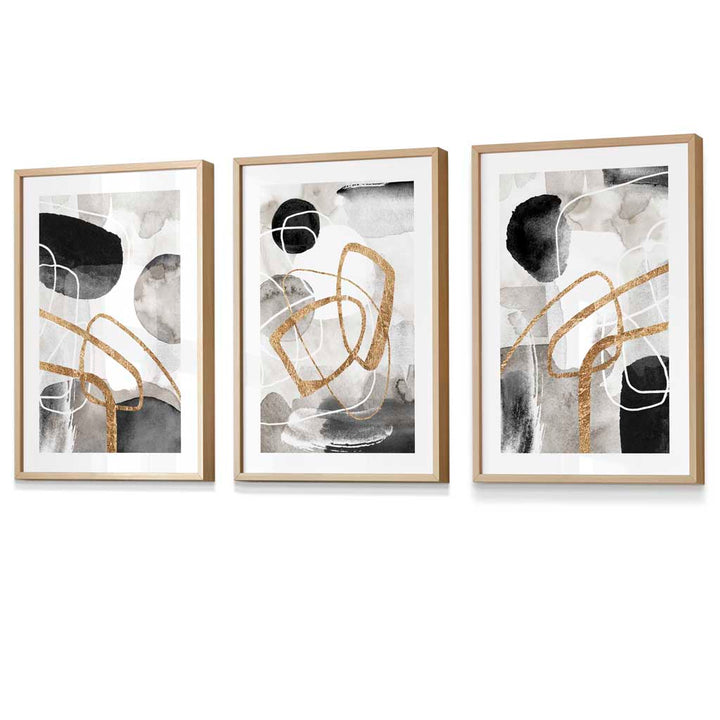 Abstract black, gray, and gold shapes set of 3 framed wall art prints | Bowlift