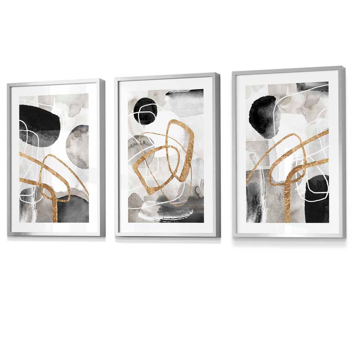 Abstract black, gray, and gold shapes set of 3 framed wall art prints | Bowlift