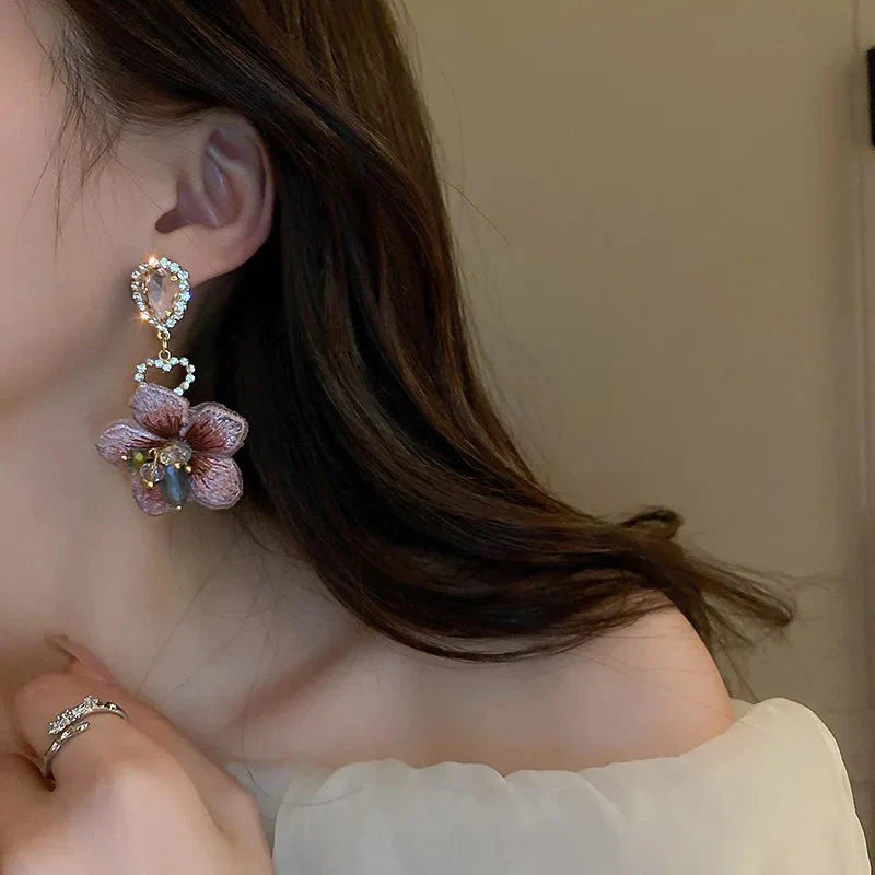 BowLift | Asymmetrical Oriental Hibiscus Crystal Earrings