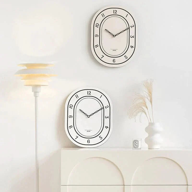 BowLift | Silent Oval Wall Clock with Roman Numerals Design