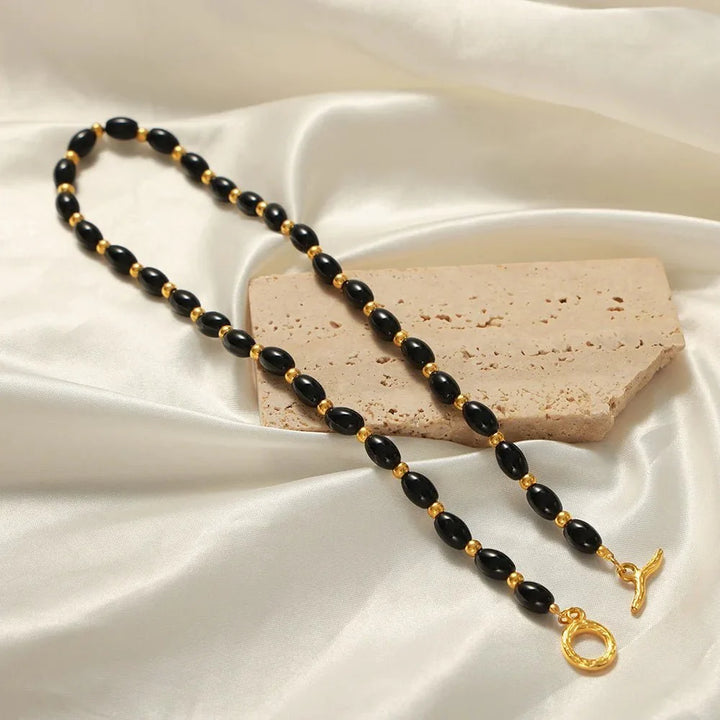 BowLift | Boho Beaded Black and Gold Circle Clasp Necklace