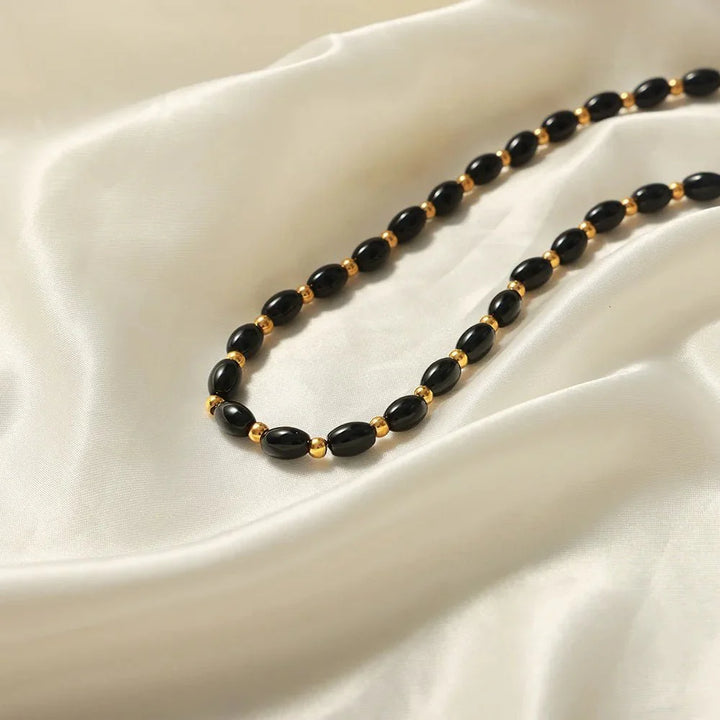 BowLift | Boho Beaded Black and Gold Circle Clasp Necklace