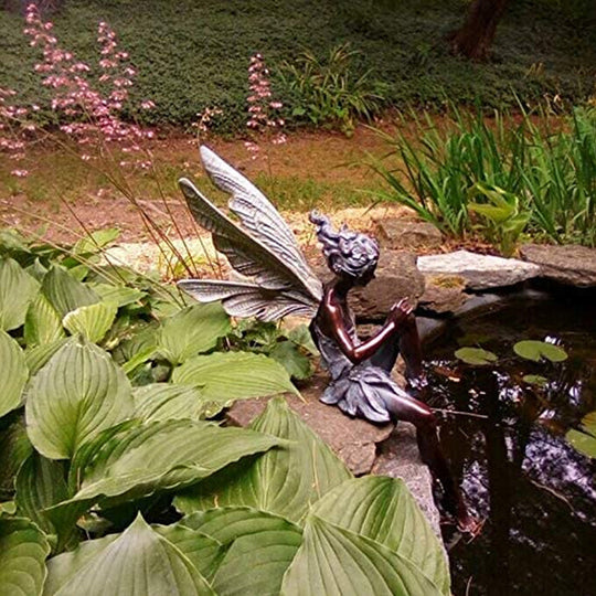 BowLift | Statue of sitting fairy in the garden