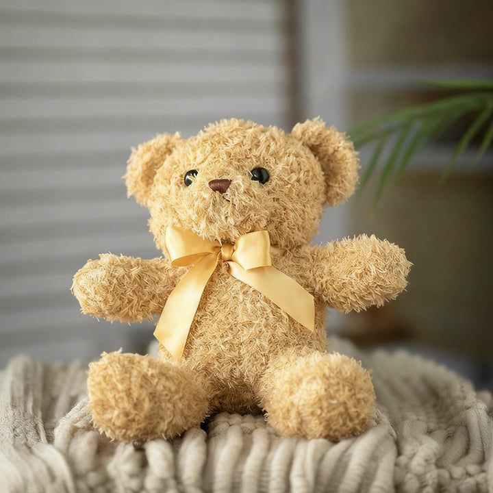 Plush teddy bear with bow, 25–30 cm
