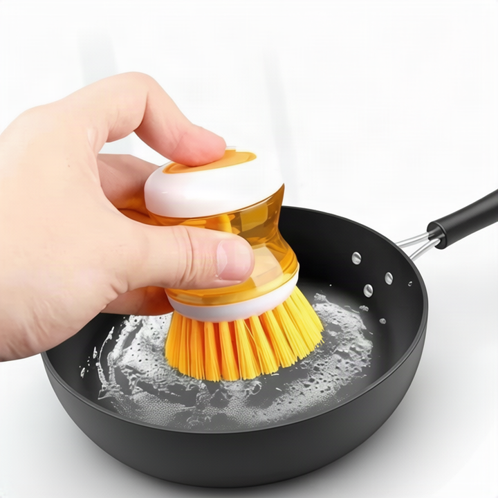 Dish brush with soap dispenser for pressing