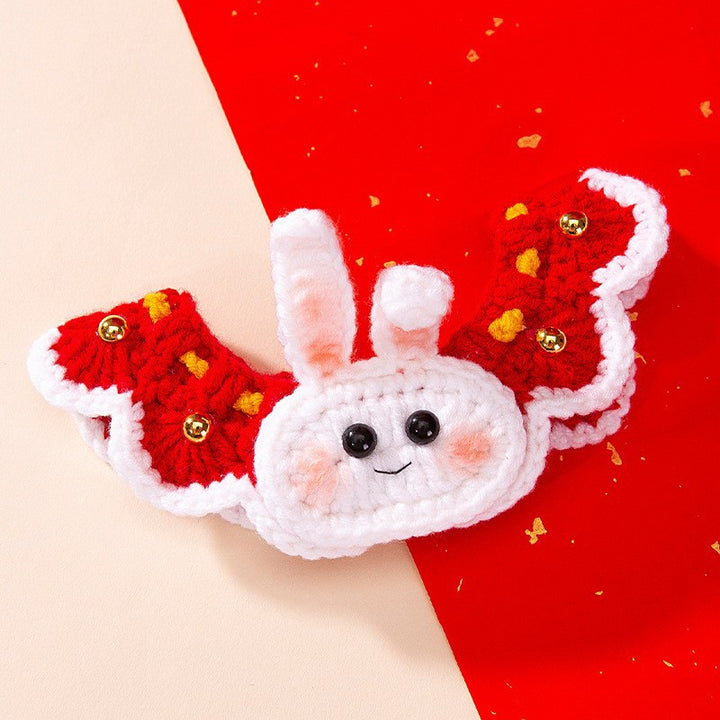 Knitted pet bandana with festive patterns
