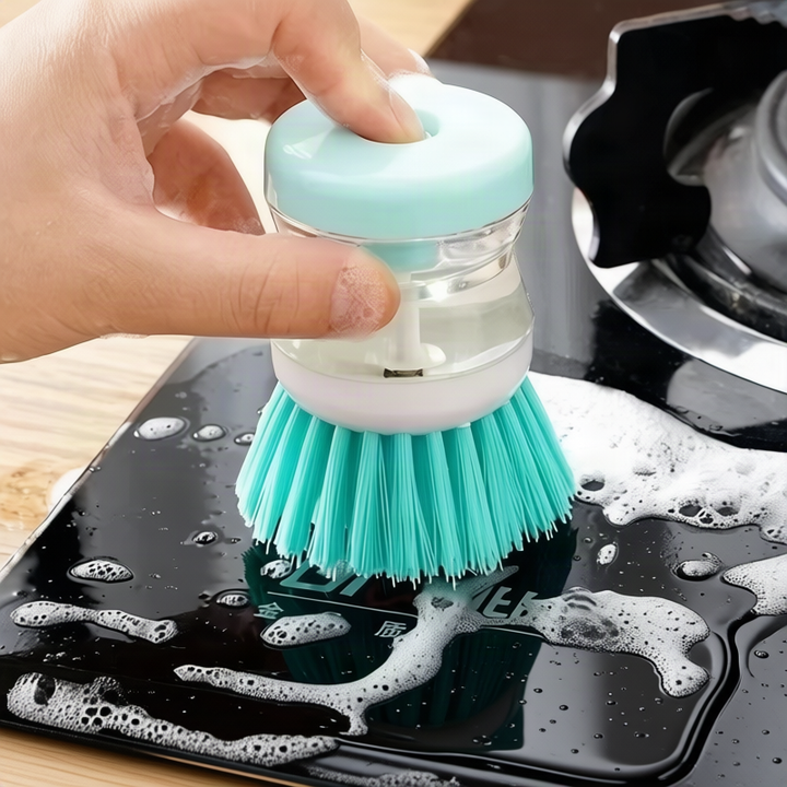 Dish brush with soap dispenser for pressing