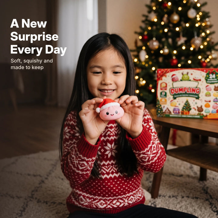 Girl holding a pink squishy dumpling toy with a Santa hat