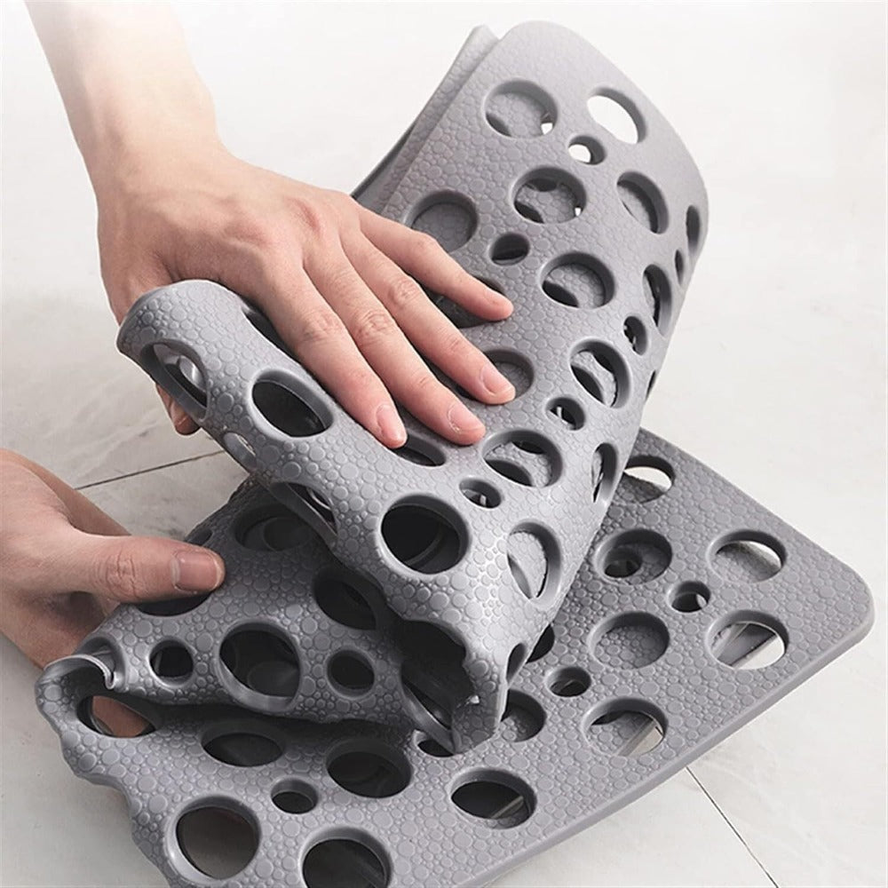 Shower mat with suction cups and drainage holes | Bowlift